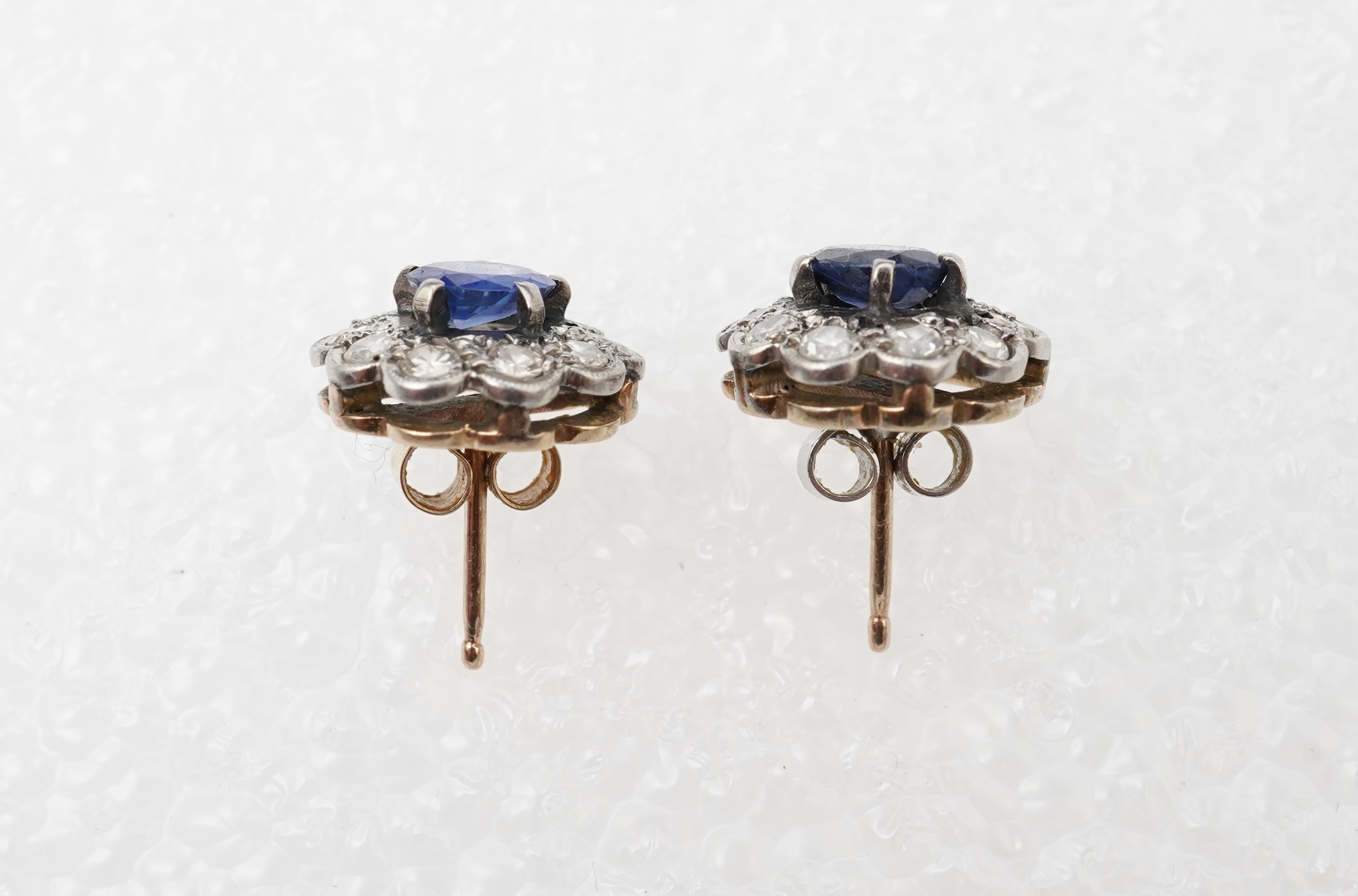 A pair of sapphire and diamond studs, mid 20th century